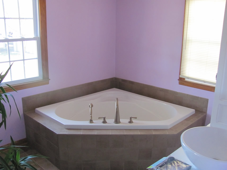 Corner garden tub in renovated bathroom